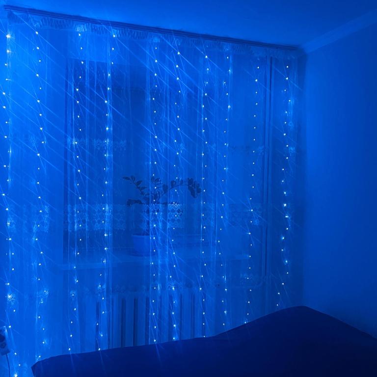 a blue room with a window with a curtain at 1ком КВ по суточно, по часовой in Koshi