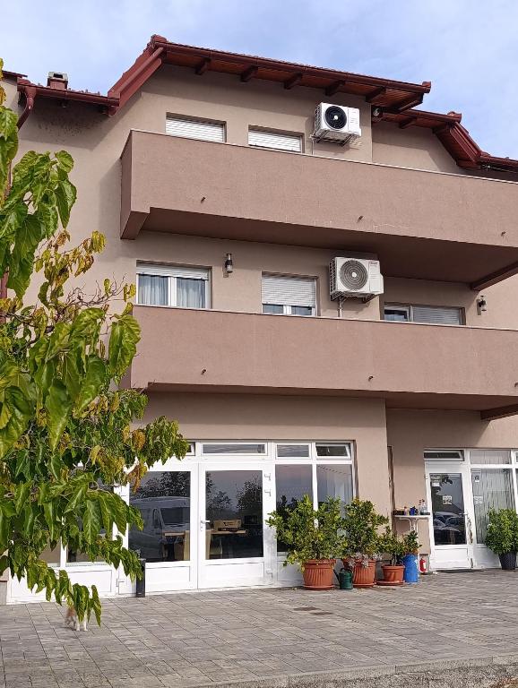 a building with speakers on the side of it at Luxury suites Marušić sobe in Brodski Varoš