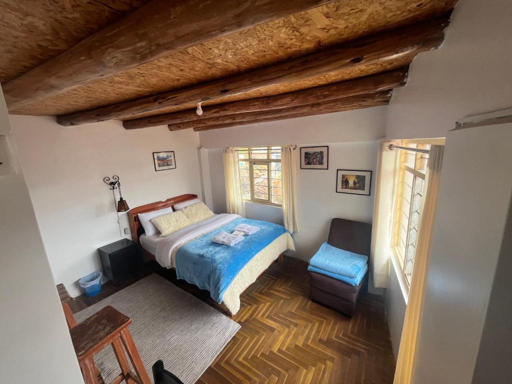 a bedroom with a bed and a window at Sky Garden in Cusco