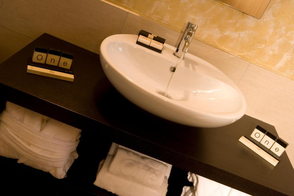 Koupelna v ubytování OneMhotel
