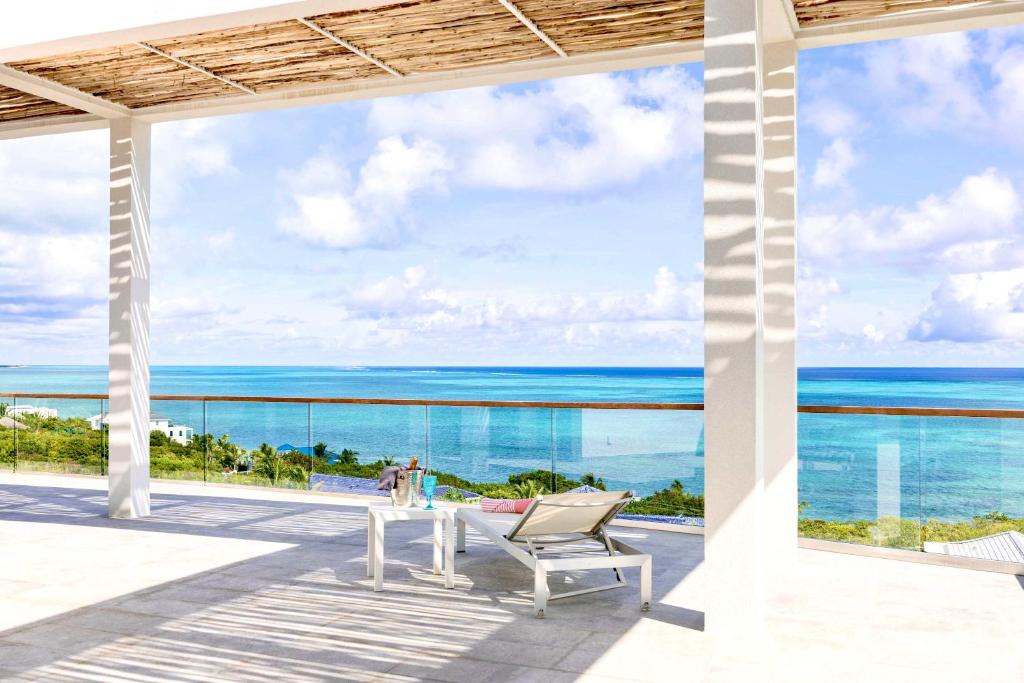 a view of the ocean from the balcony of a villa at Villa Skyline with stunning Ocean View in Turtle Cove