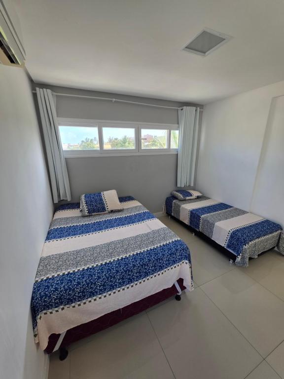 Postel nebo postele na pokoji v ubytování Refúgio da Praia Aracaju