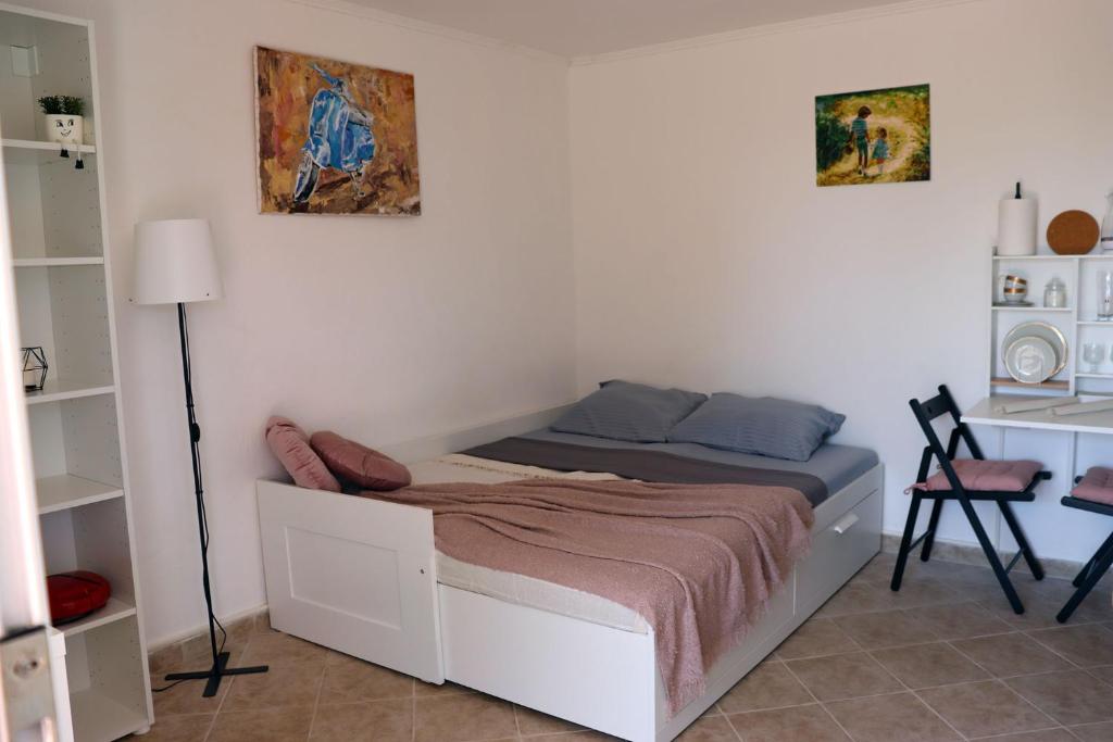 Postel nebo postele na pokoji v ubytování Teona-Apartments