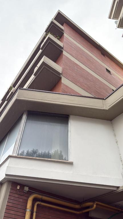 a window on the side of a house at RUS Apartment in Florence