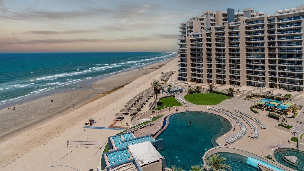 an aerial view of a hotel and the beach at Las Palomas 2 BR 2 BA Diamante 707 in Puerto Peñasco