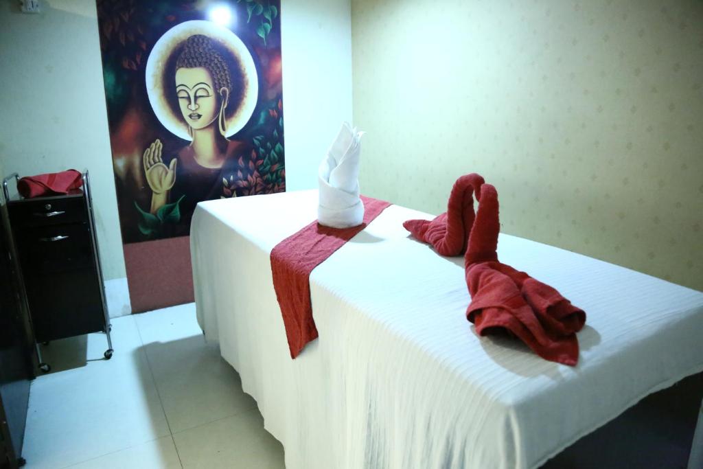 Postel nebo postele na pokoji v ubytování Hotel Rajshree & Spa