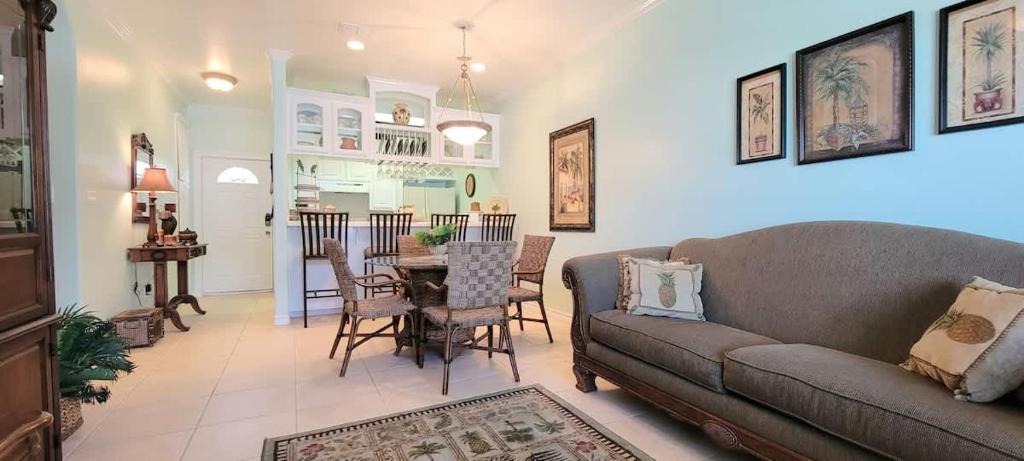 a living room with a couch and a table at Great Location Pool Near the Beach in South Padre Island