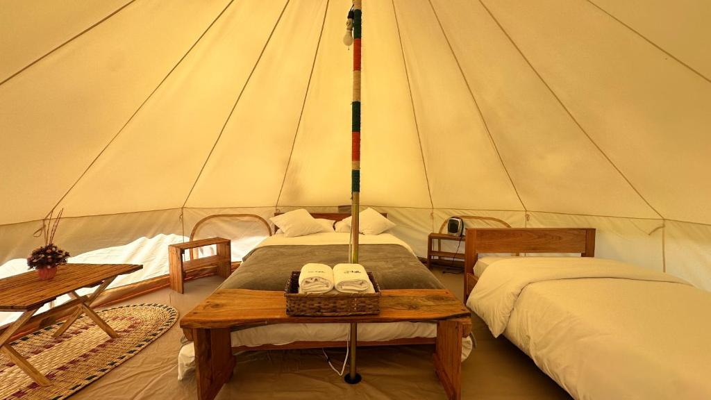 Postel nebo postele na pokoji v ubytování QuillaGlamping