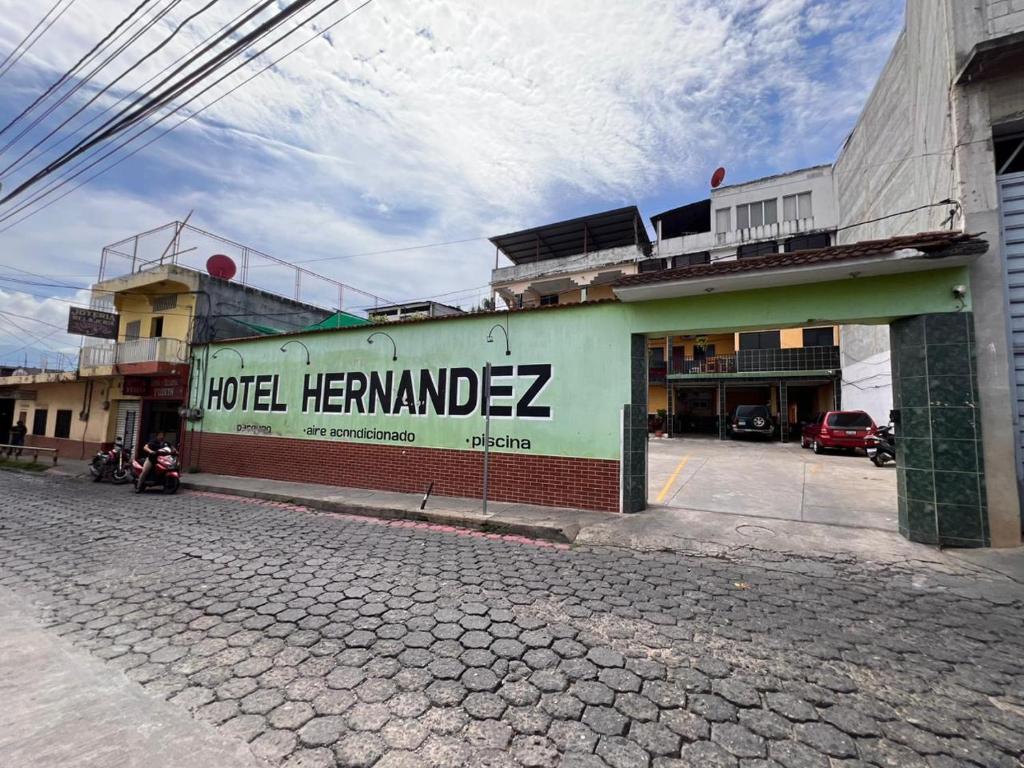 a building with a sign on the side of it at Hotel Hernandez in Chiquimula