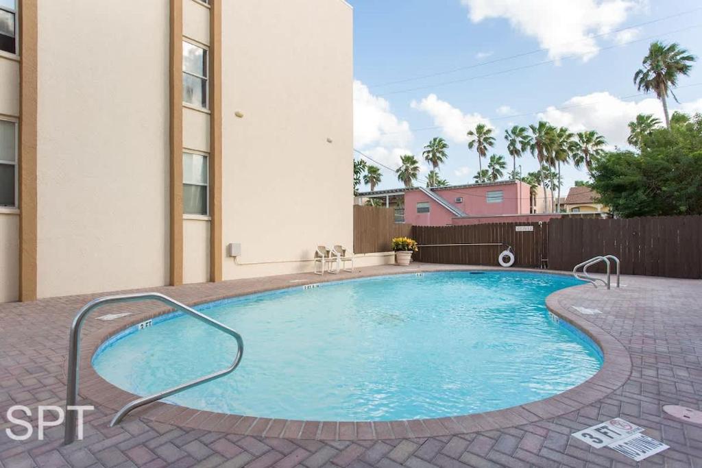 a swimming pool in the middle of a building at Max Walkable Location 1st Floor 2 Patios in South Padre Island