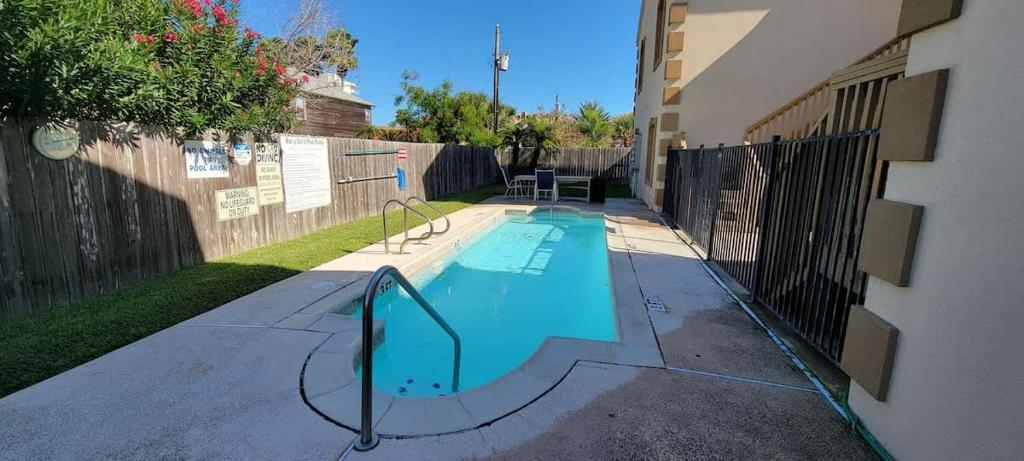 a swimming pool in the middle of a house at EZ Walk to Beach Modern 2 bedroom Sleeps Many in South Padre Island