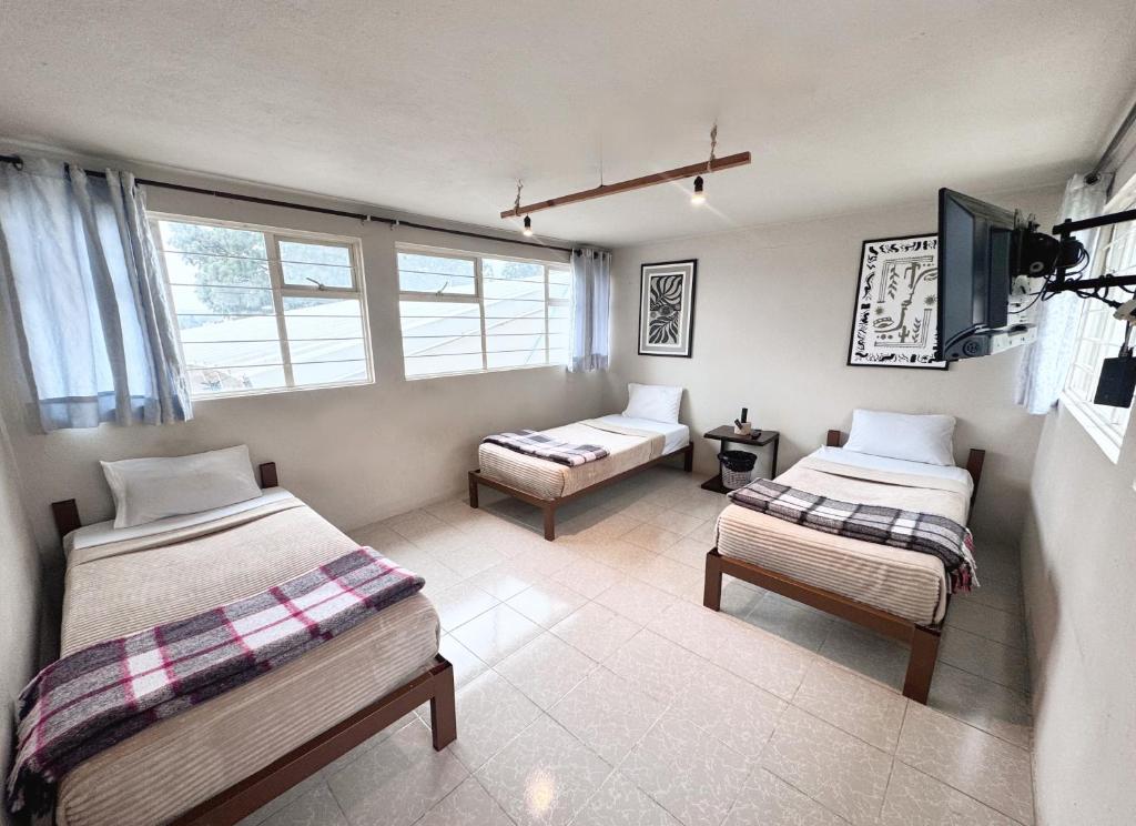 Ένα ή περισσότερα κρεβάτια σε δωμάτιο στο Casa Mi Ranchito