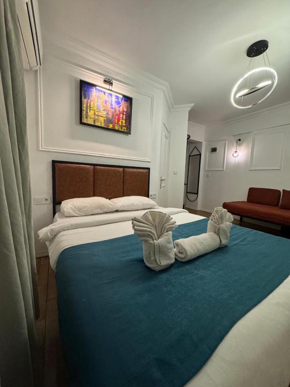 Ένα ή περισσότερα κρεβάτια σε δωμάτιο στο Veva Hotel