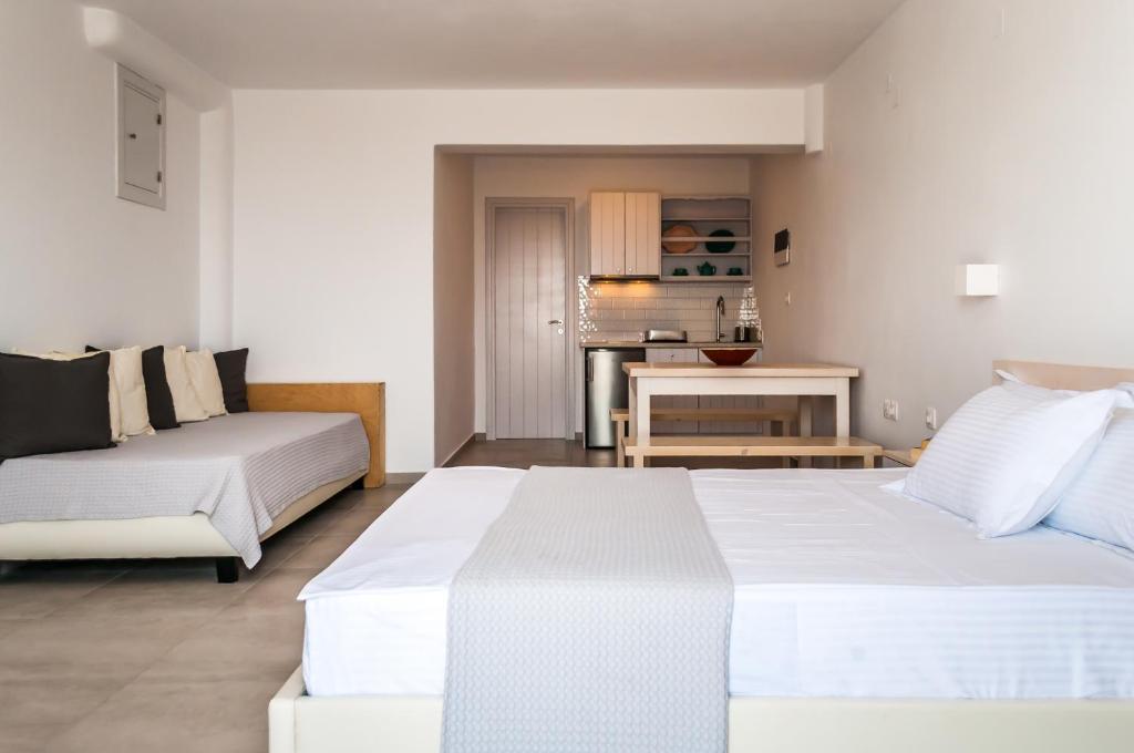 Postel nebo postele na pokoji v ubytování Hotel Ippocampos Studios