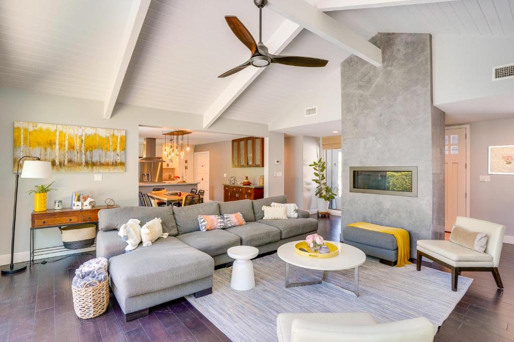 a living room with a couch and a table at Mid Century Modern Gem with Pool in North Tustin in La Paloma