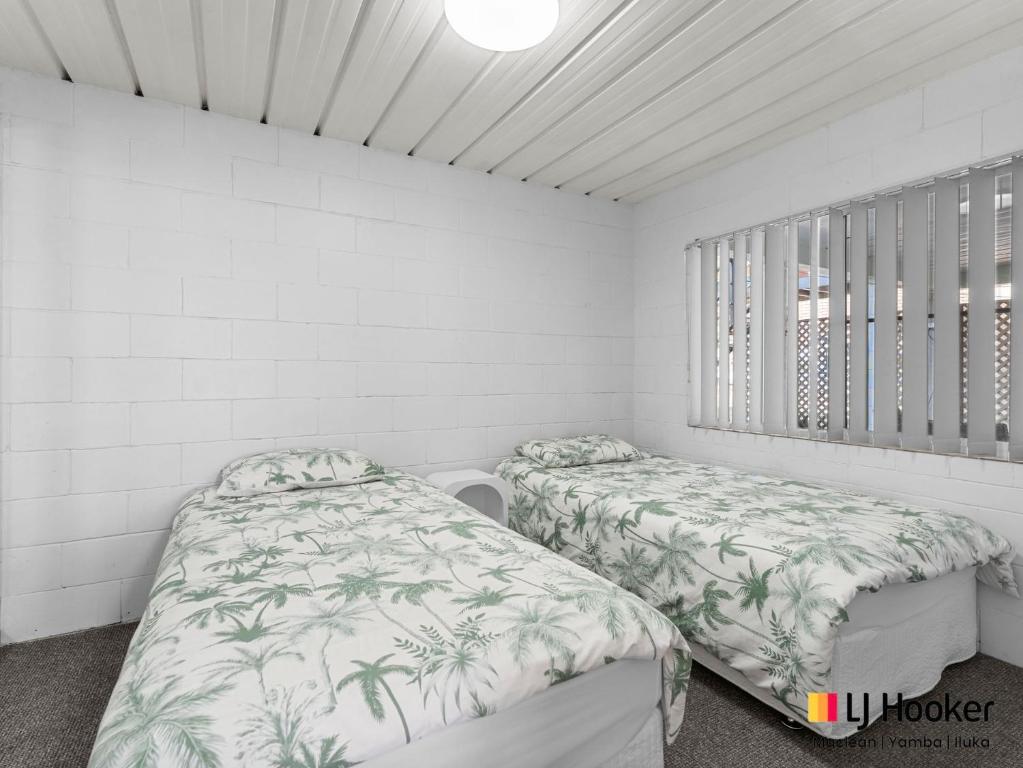 Postel nebo postele na pokoji v ubytování Bay Breeze