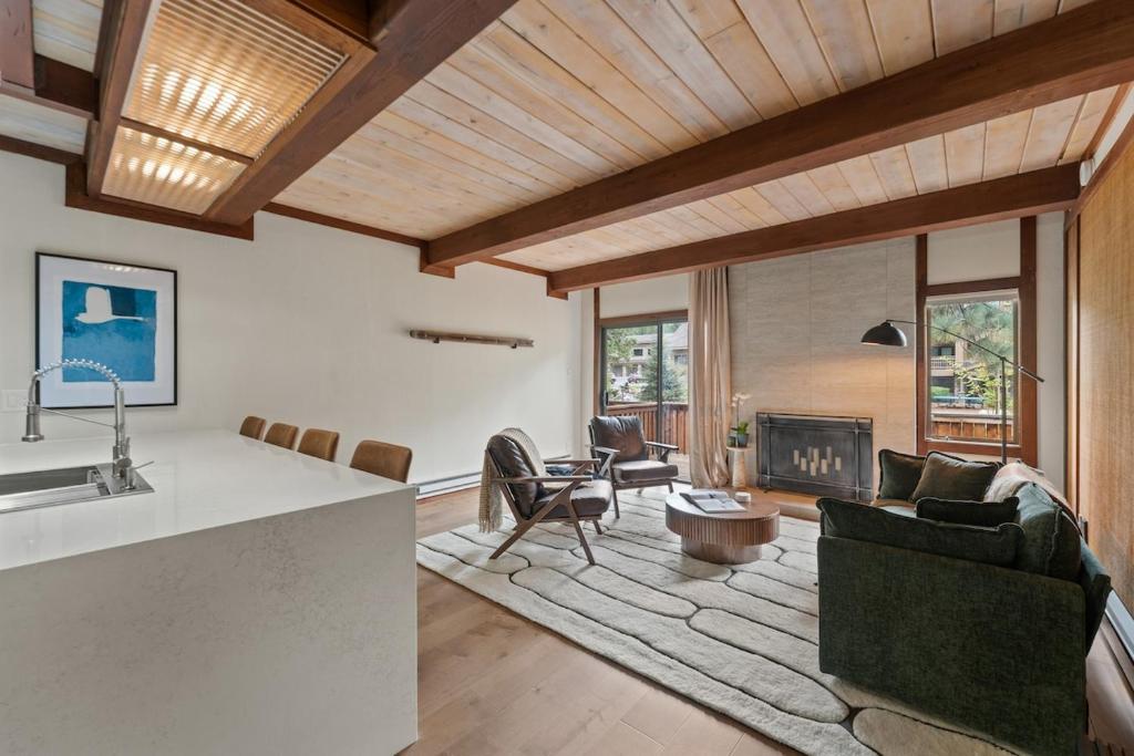 a living room with a couch and a fireplace at Charming Tahoe Cabin in Incline Village