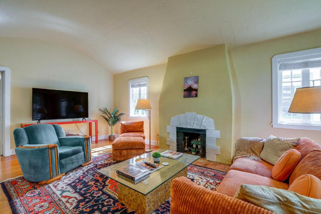 a living room with two couches and a fireplace at Extended Stay in Sacramento! Dog-Friendly Home in Oak Park