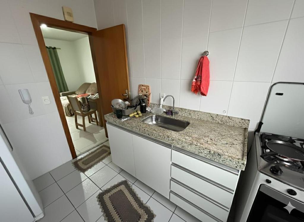 a kitchen with a sink and a counter top at Cobertura Duplex super confortável melhor localização BH in Belo Horizonte