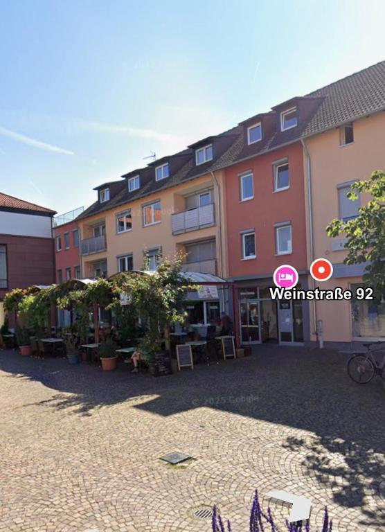 a group of buildings in a courtyard at Ferienwohnung Portofino Edenkoben in Edenkoben