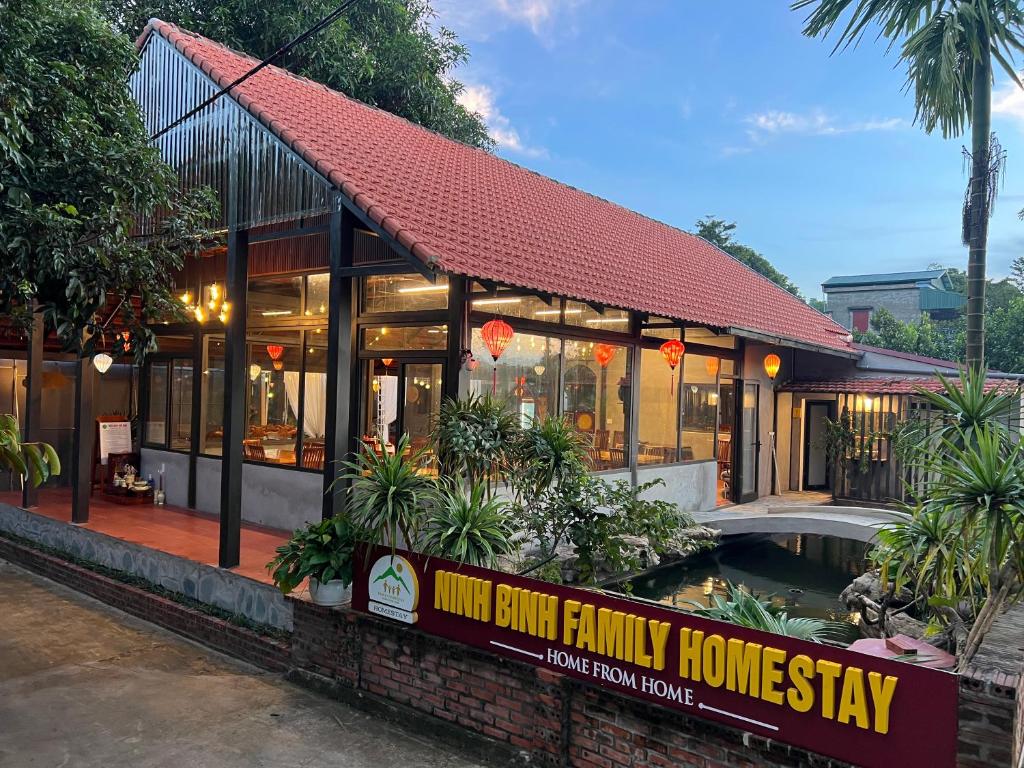 a restaurant with a sign in front of a building at Ninh Binh Family Homestay in Ninh Binh