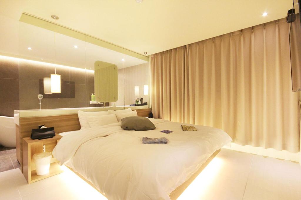 Ένα ή περισσότερα κρεβάτια σε δωμάτιο στο Hotel Yaja Sasang Terminal