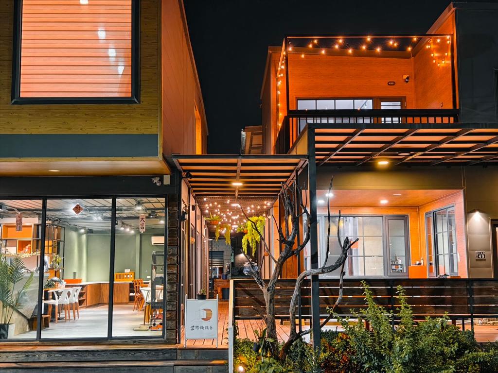 a building with lights on the side of it at Twenty Eight B&B in Xiaoliuqiu
