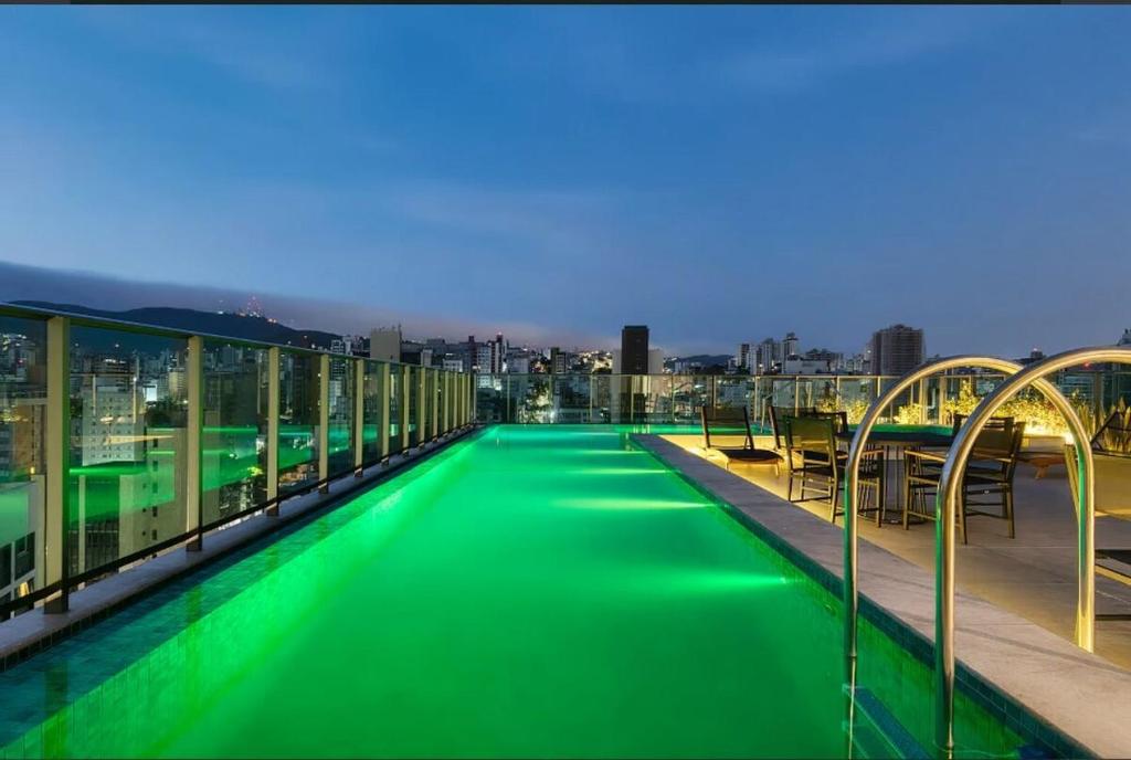 a swimming pool on the roof of a building at Savassi Luxury 2BR Pool and Home Office in Belo Horizonte