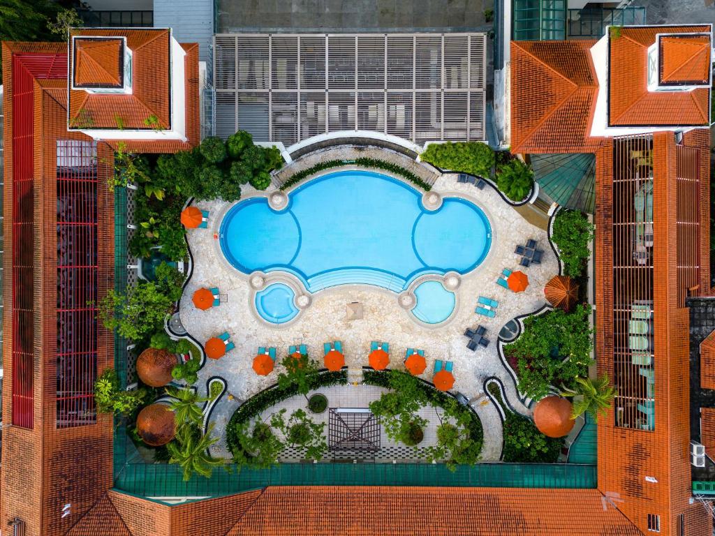 an overhead view of a pool at a resort at JEN Singapore Tanglin by Shangri-La in Singapore