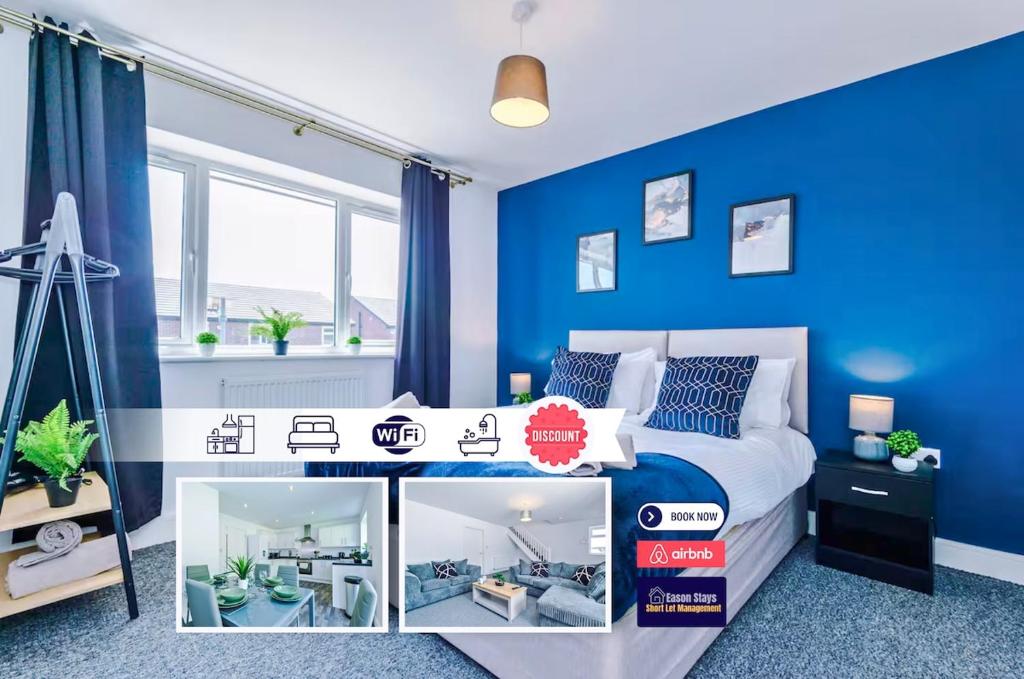 a bedroom with blue walls and a bed with a table at 4 BDR House By Eason Stays Short Lets & Serviced Accommodation St Helens With Free Parking in Saint Helens