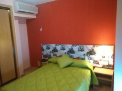 A bed or beds in a room at Hotel Don Angel