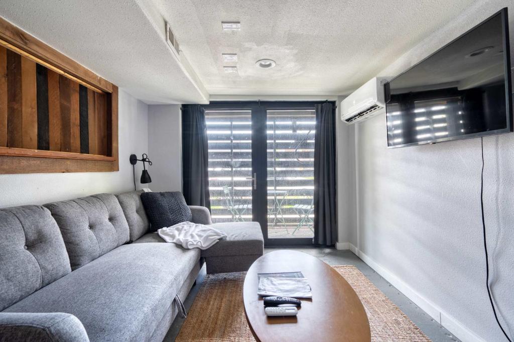 a living room with a couch and a table at Unique Portland Home in Pearl District Sleeps 4 in Portland
