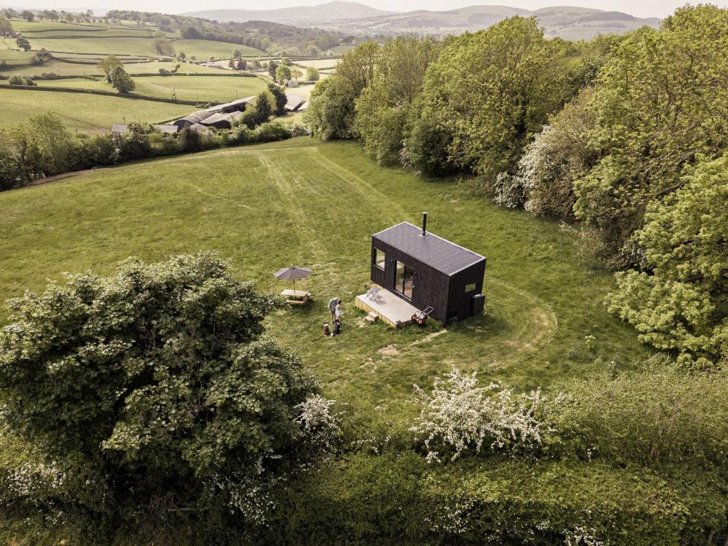 an overhead view of a tiny house in a field at Altair in Holywell