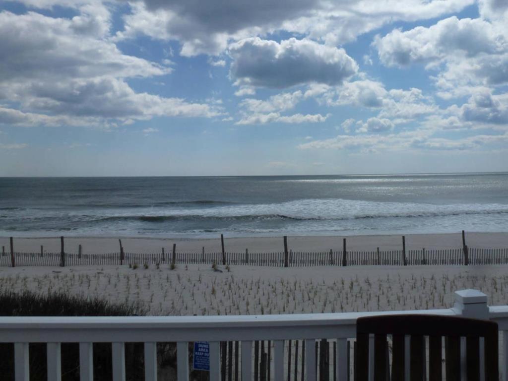 a view of a beach with a fence and the ocean at Holgate Ocean Front Duplex 2Nd Fl 14018 in Holgate