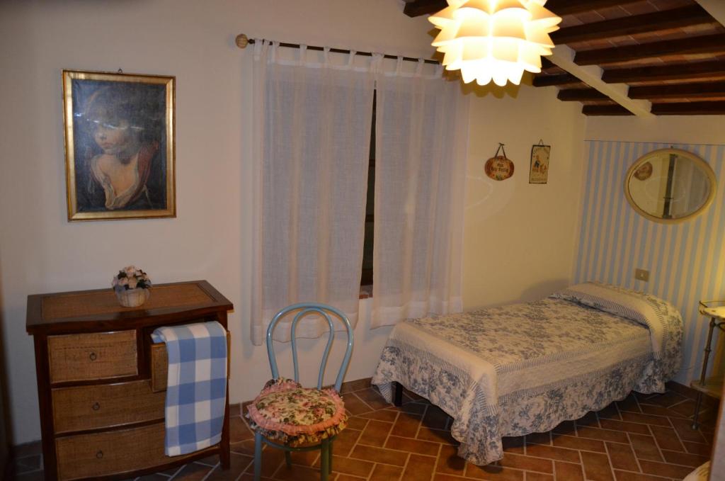 Postel nebo postele na pokoji v ubytování Agriturismo Sant'Alfredo