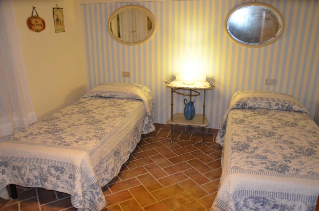 Postel nebo postele na pokoji v ubytování Agriturismo Sant'Alfredo