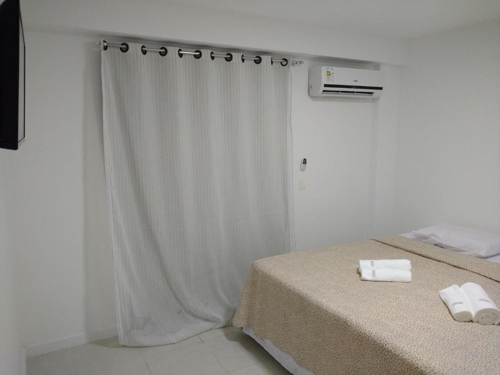 Cama ou camas em um quarto em Reserva Pontal Beach