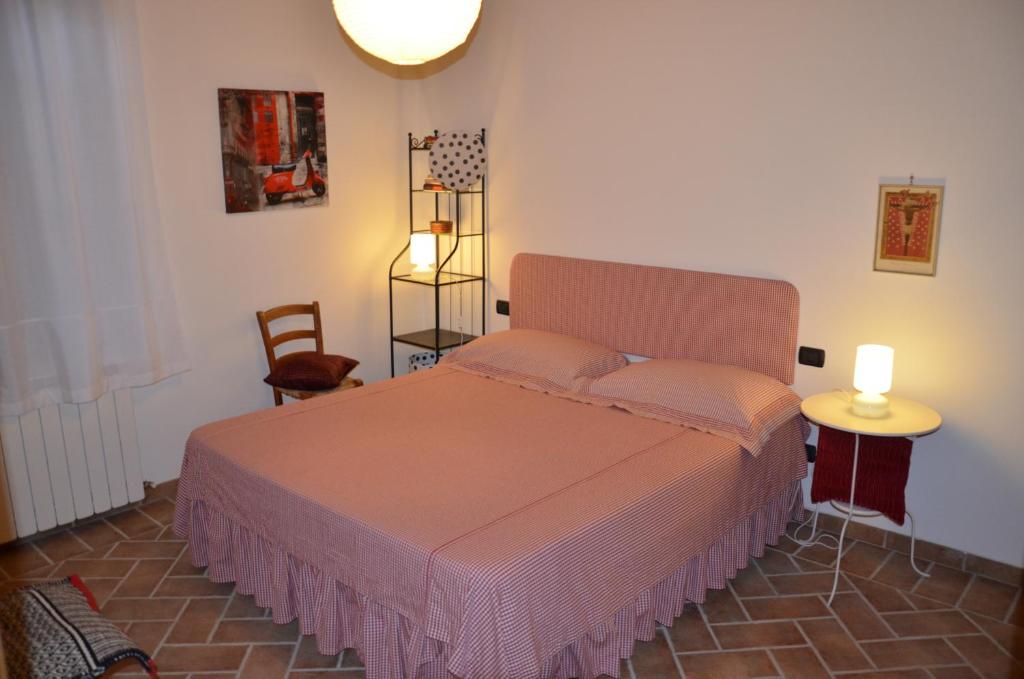 Postel nebo postele na pokoji v ubytování Agriturismo Sant'Alfredo