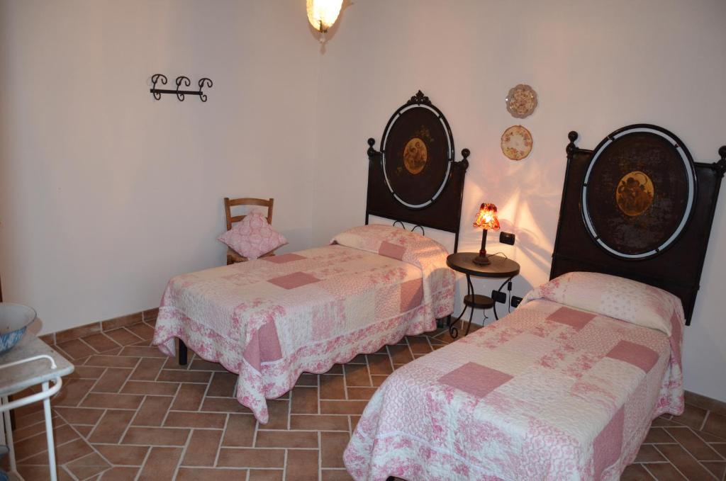 Postel nebo postele na pokoji v ubytování Agriturismo Sant'Alfredo