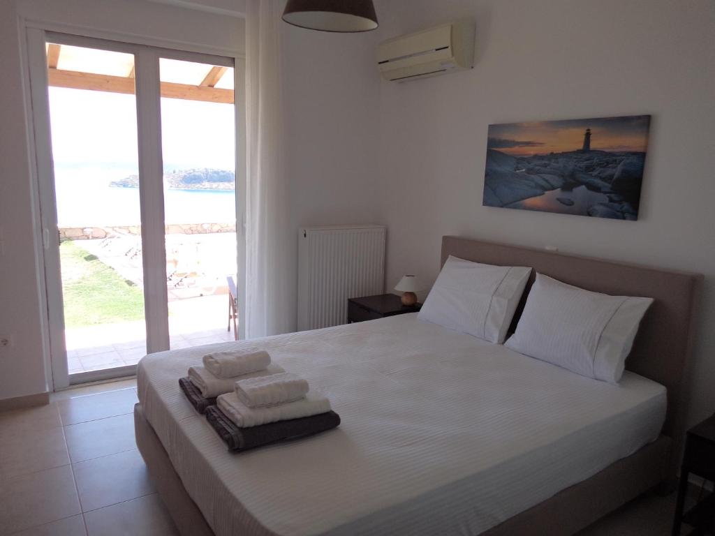 Кровать или кровати в номере Lefka's Villas