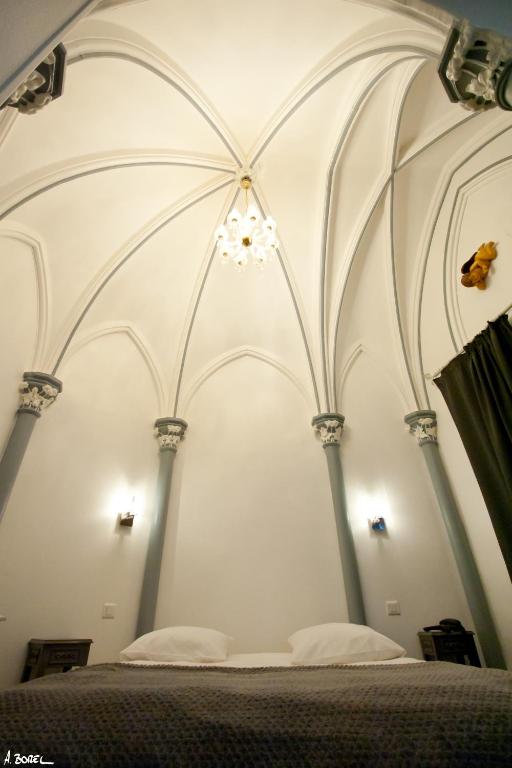 Postel nebo postele na pokoji v ubytování Hotel Le Prieuré et La Résidence