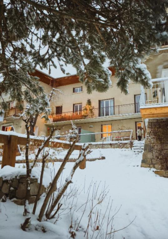 a building with snow in front of it at Mountain getaway in Saint-Chaffrey in Saint-Chaffrey