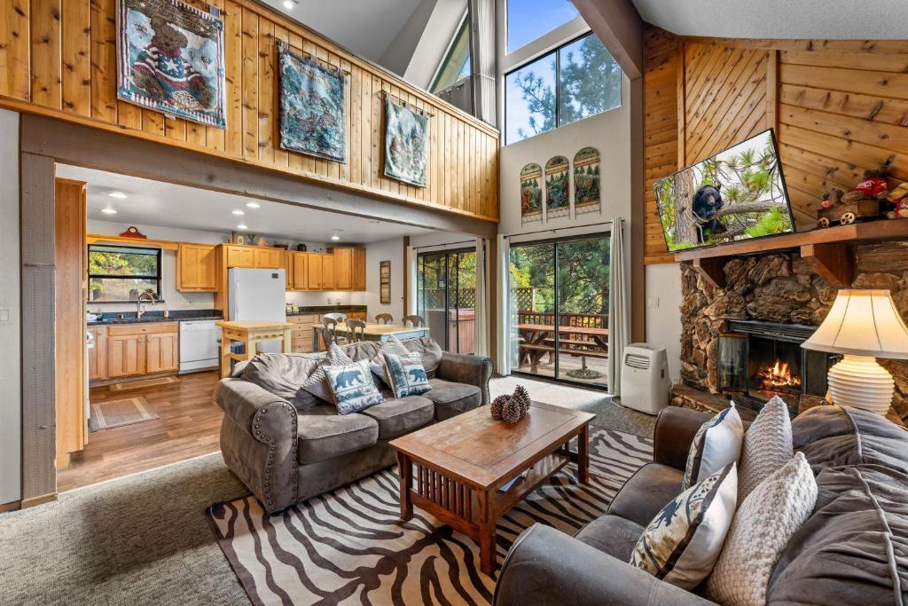 a living room filled with furniture and a fireplace at Bear Canyon: Large Cabin, Beautiful Views & HotTub in Big Bear Lake