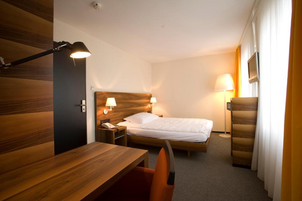 Uma cama ou camas num quarto em Hotel Astoria