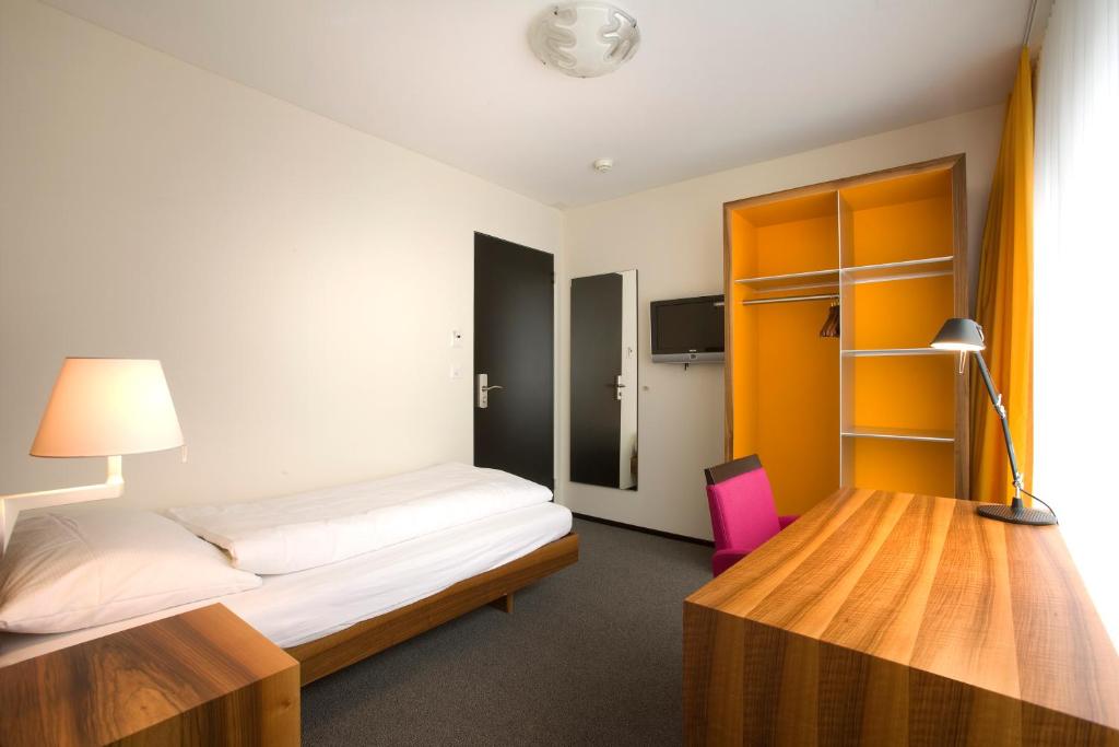 Uma cama ou camas num quarto em Hotel Astoria
