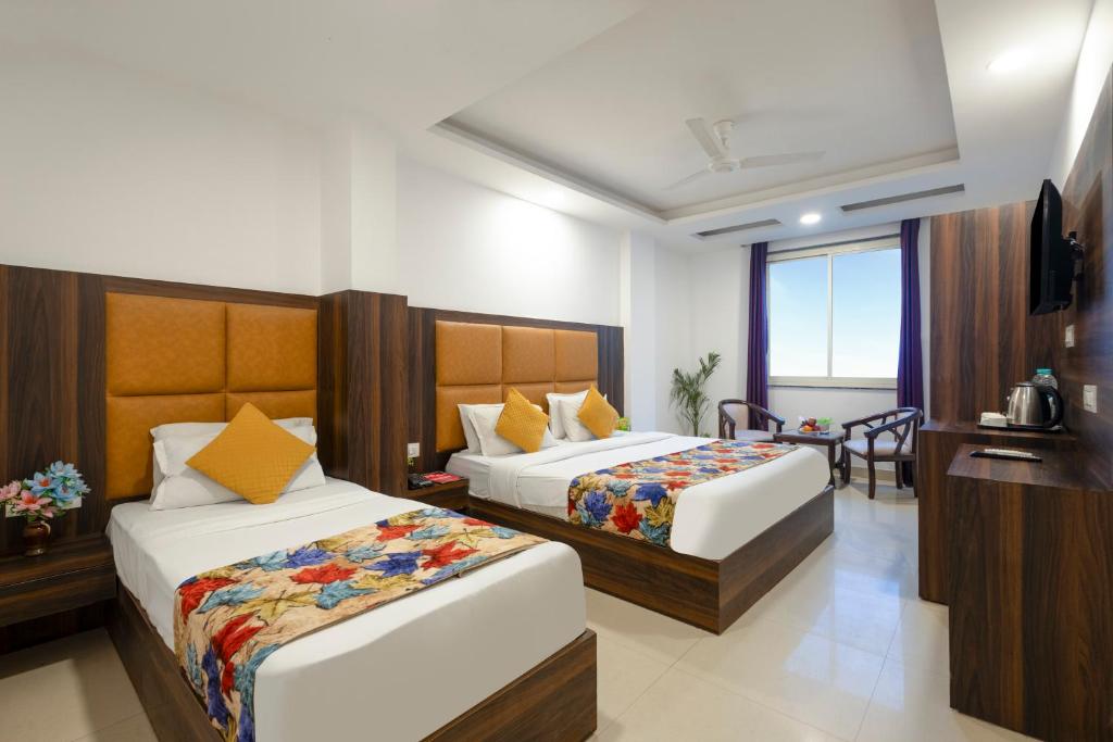 Ένα ή περισσότερα κρεβάτια σε δωμάτιο στο Hotel Daira Suite Delhi