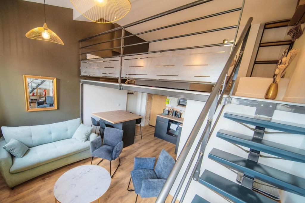 a view of a living room and kitchen from a loft at The Little Dumont - 2-person Apartment - Croix-Rousse in Lyon
