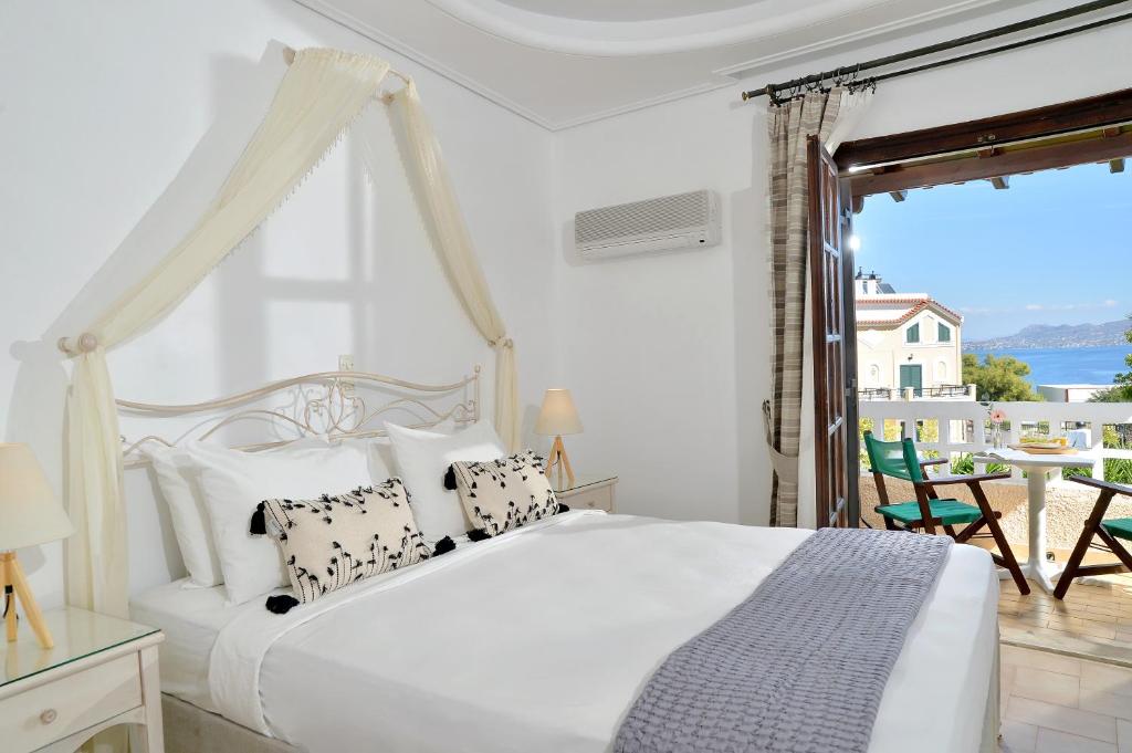 Postel nebo postele na pokoji v ubytování Vasilaras Hotel