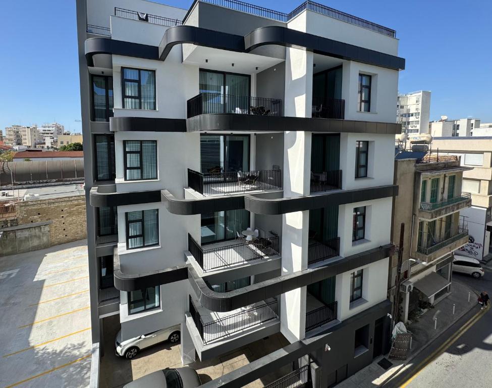 a building with balconies on the side of it at LEONARDOSUITES Limassol in Limassol
