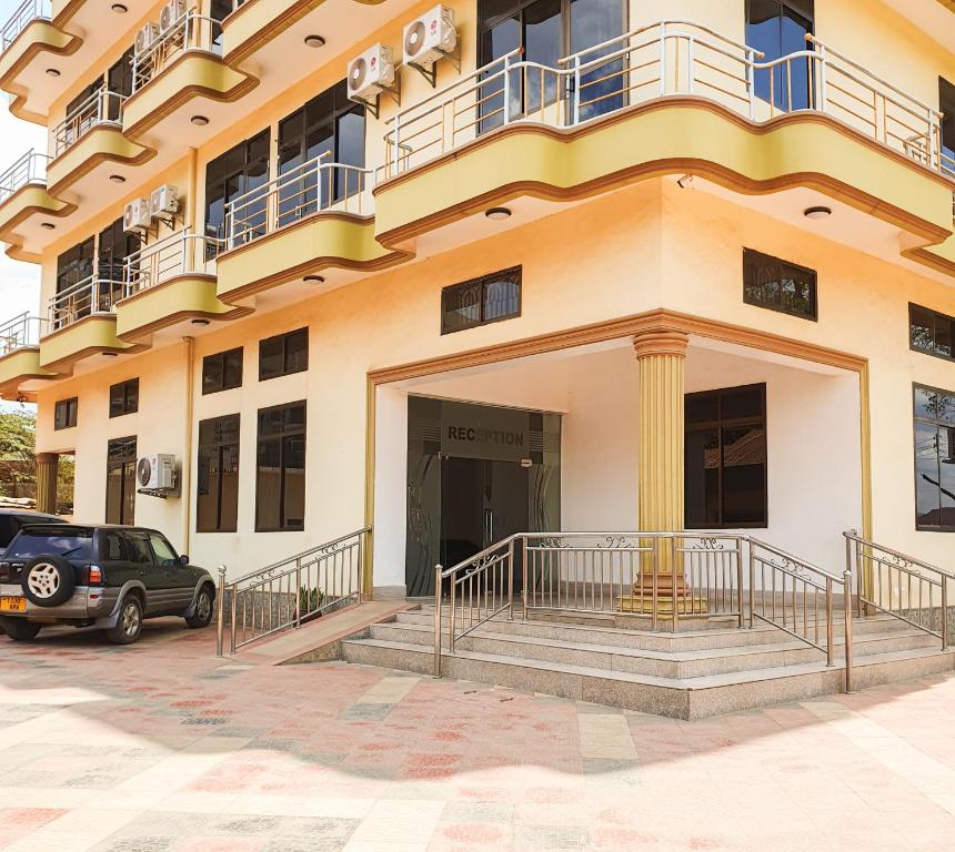 a building with a car parked in front of it at Lesilale Hotel in Morogoro